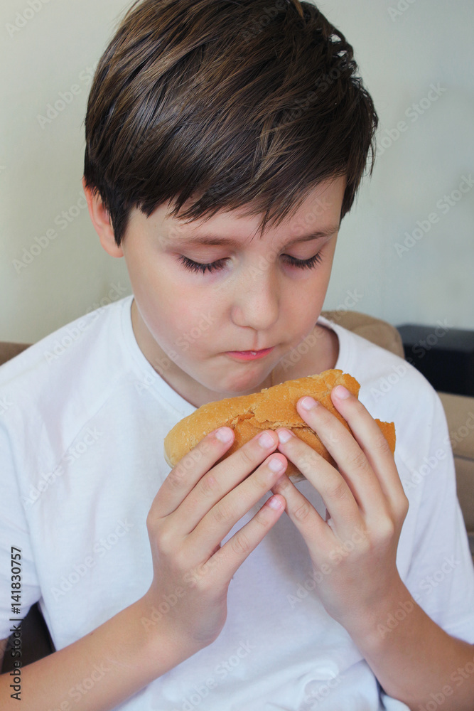 Boy eats white bread Stock Photo Adobe Stock