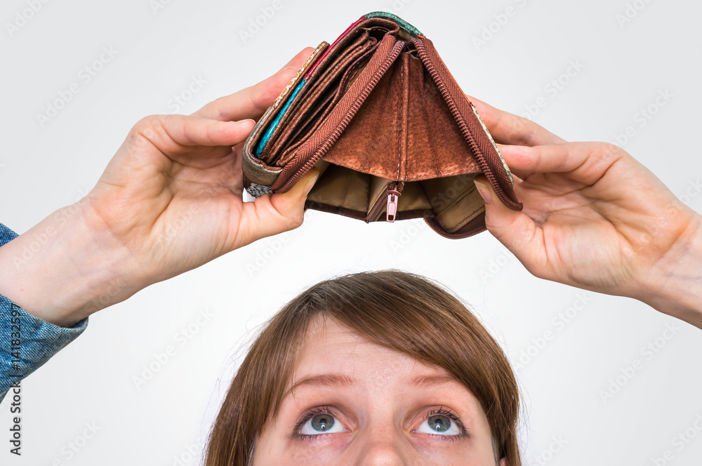 Woman holding an empty wallet, she hasn't money Stock Photo | Adobe Stock