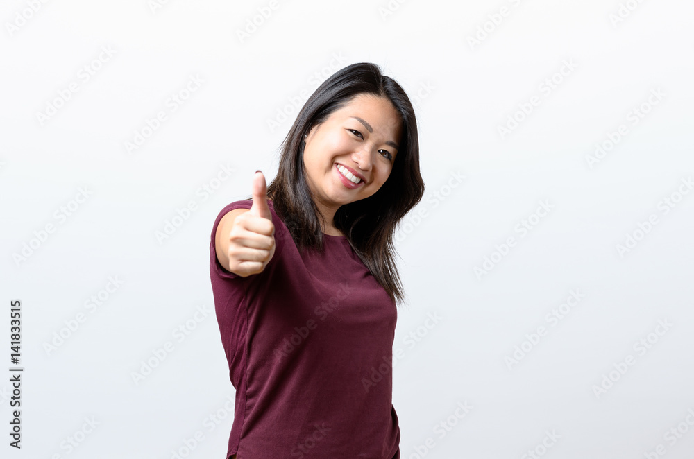 Enthusiastic motivated woman giving a thumb up Enthusiastic motivated woman giving a thumb up