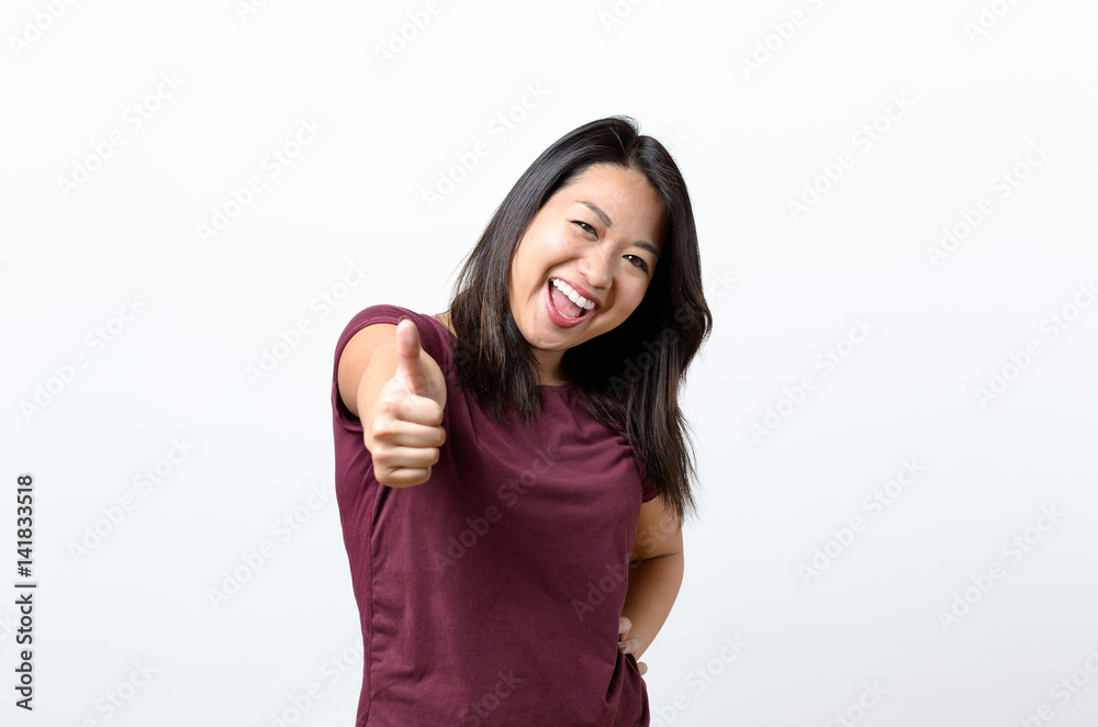 Enthusiastic motivated woman giving a thumb up Enthusiastic motivated woman giving a thumb up