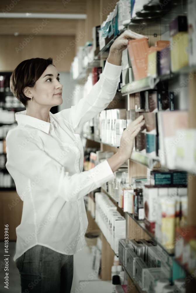Female customer searching for reliable drug