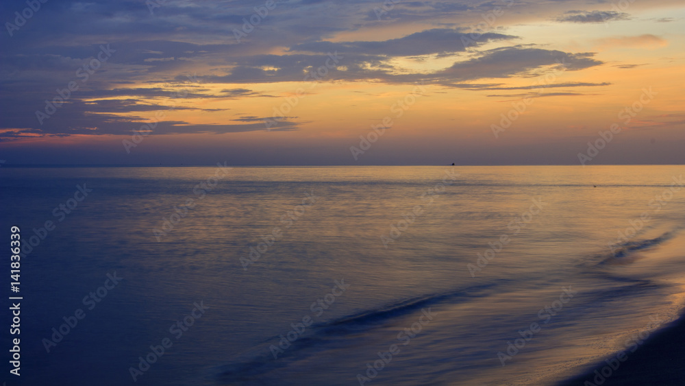 View of sea and cloudy sky at dawn ; Samila beach, Songkhla, southern of Thailand (slow shutter speeds)