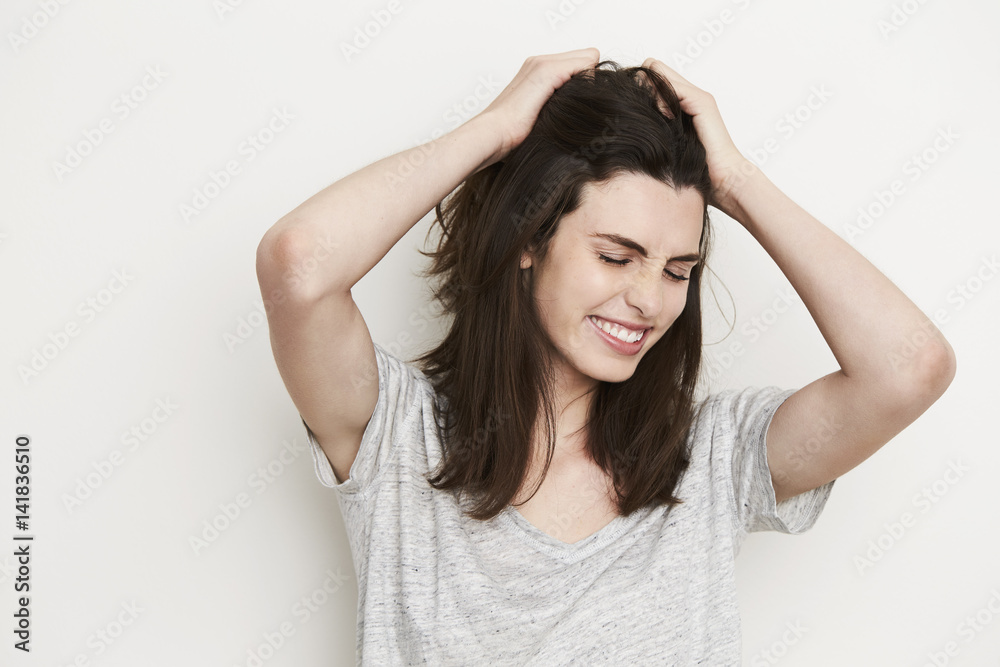 Frustrated brunette in studio, eyes closed Frustrated brunette in studio, eyes closed