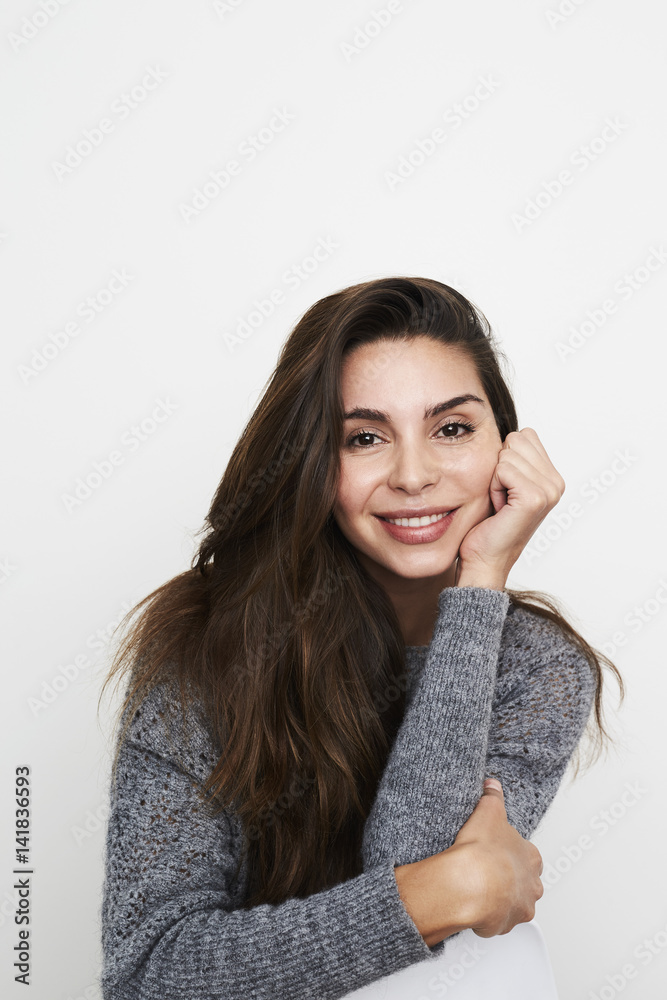 Beautiful woman smiling to camera in studio Beautiful woman smiling to camera in studio