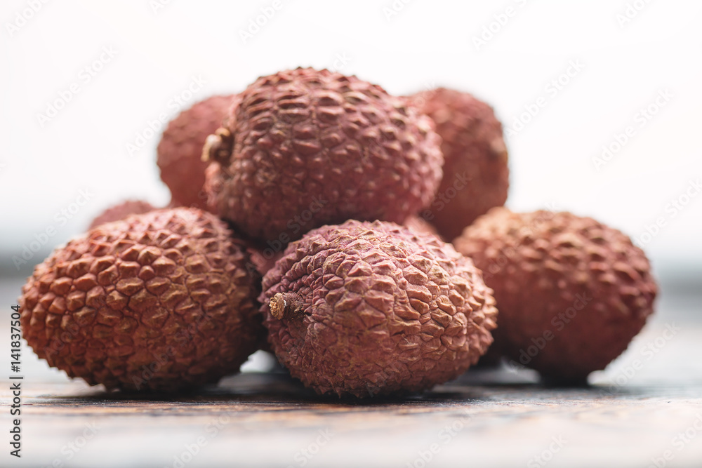 Lichee on wooden table, litchi, lychee fruit detail Lichee on wooden table, litchi, lychee fruit detail