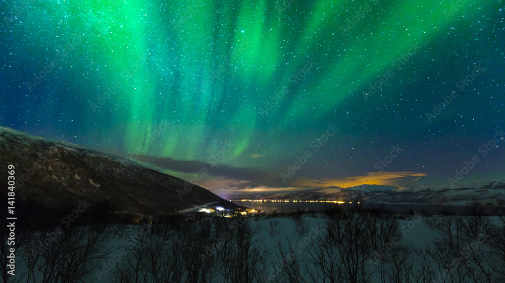 Northern lights above the village Hansnes, Troms county Norway