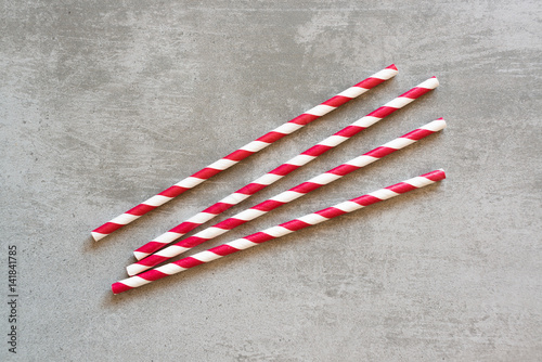 Red and white striped drinking straws photo