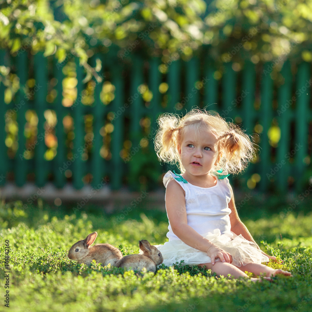 Portrait of happy pretty girl with rabbit Portrait of happy pretty girl with rabbit