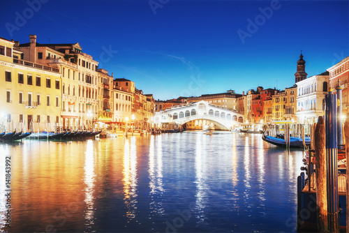 City landscape. Rialto Bridge Ponte Di Rialto in Venice, Italy at night. Many tourists visiting the beauty of the city throughout the year