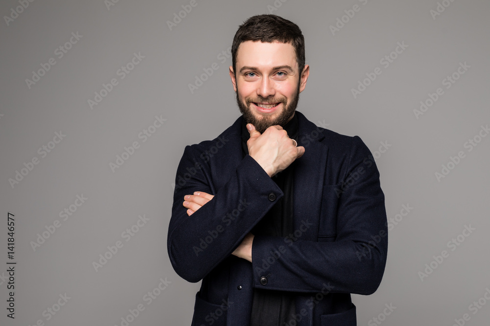 Young businessman thinking of idea on grey Young businessman thinking of idea on grey