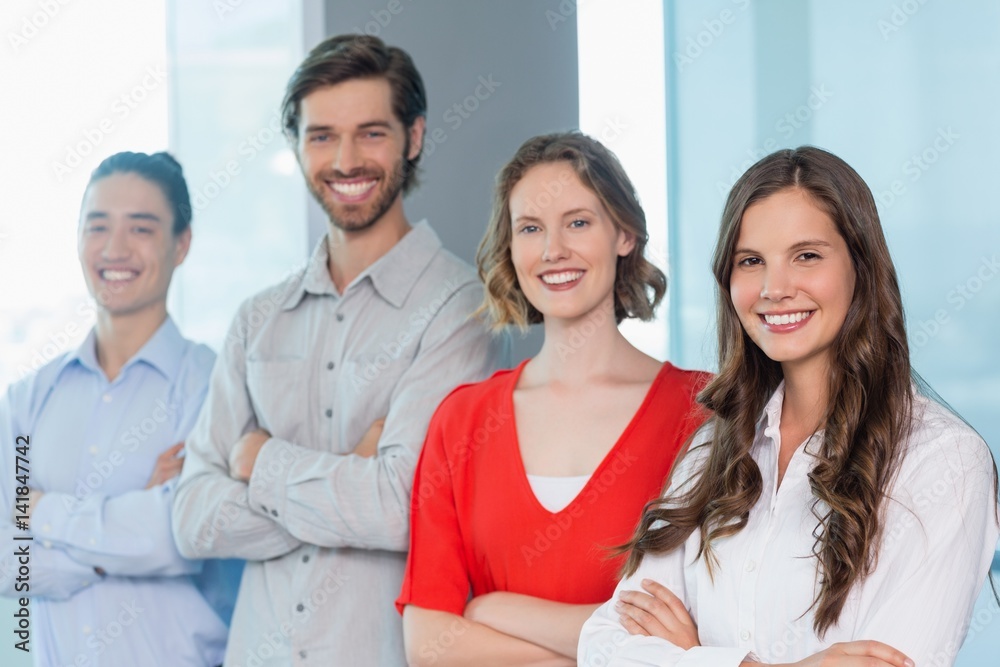 Business executives with arms crossed smiling 