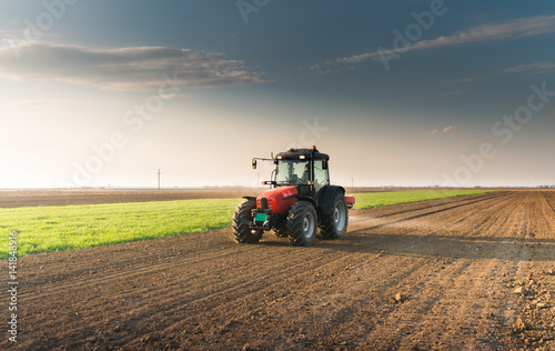 Tractor spreading artificial fertilizers