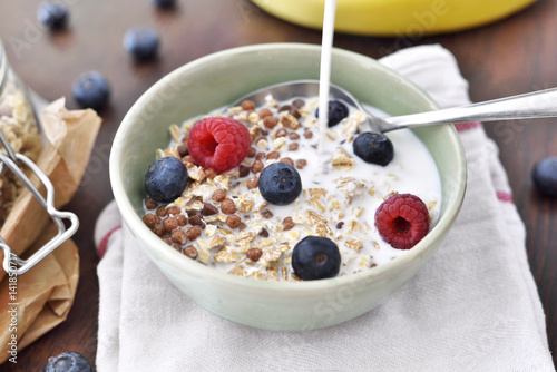 Delicious cereal breakfast with bowl and fresh fruits