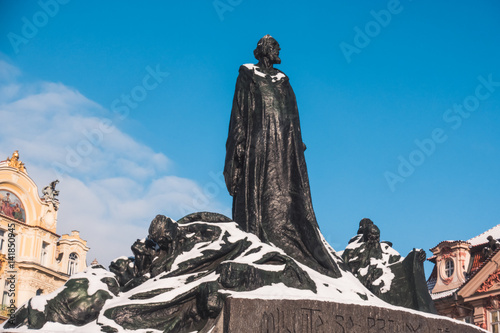 Jan Hus Memorial under the snow in Old Town Square in Prague photo