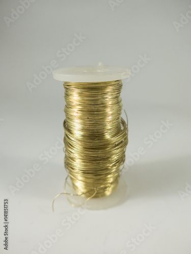 golden metal string on a white background photo