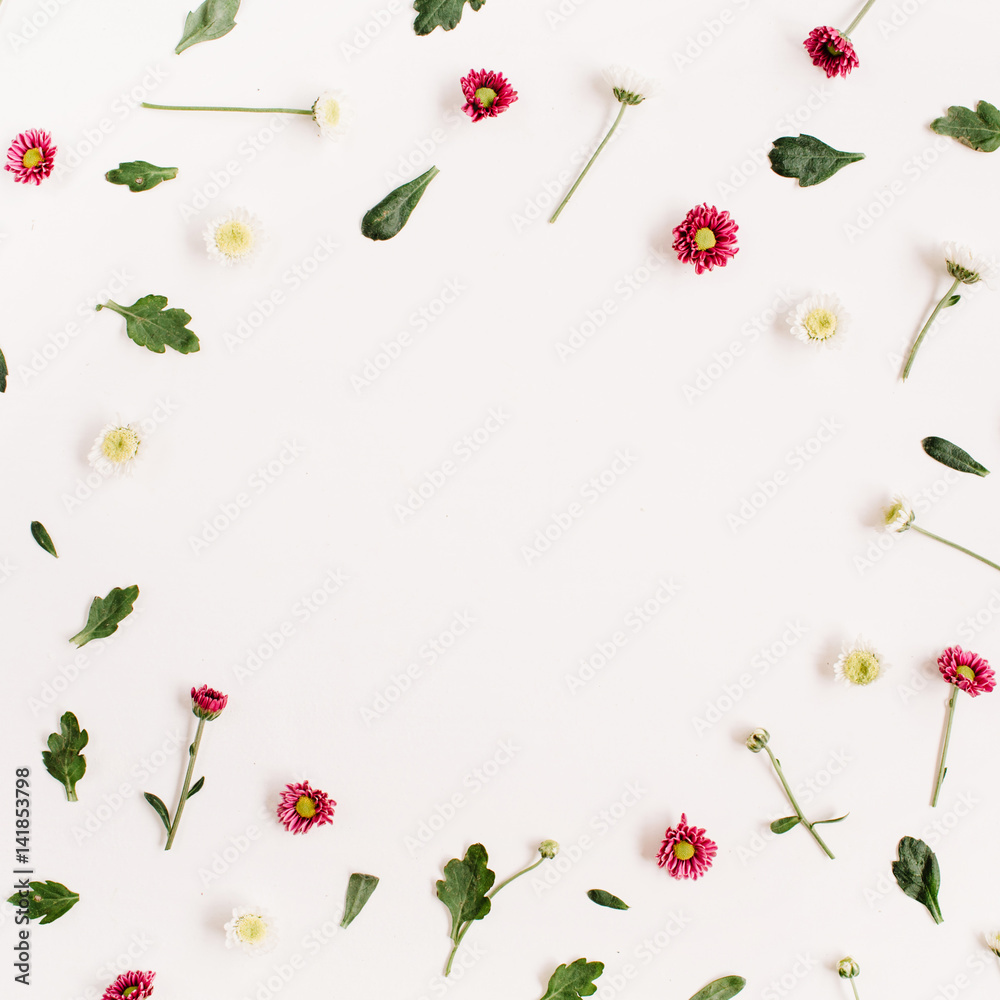 Frame wreath with red and white wildflowers, green leaves, branches on white background. Flat lay, top view. Flower background. Frame wreath with red and white wildflowers, green leaves, branches on white background. Flat lay, top view. Flower background.