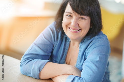 Portrait of smiling 50-year-old woman