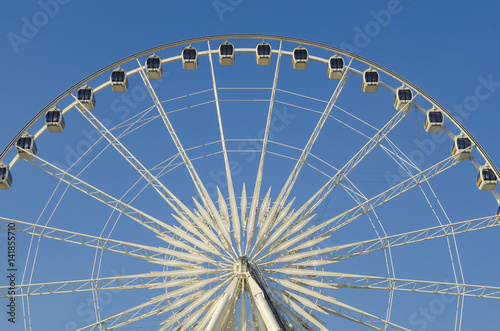 Beautiful large Ferris wheel. And the blue sky.