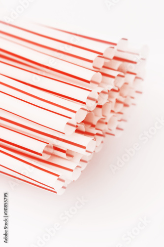 Fototapeta Naklejka Na Ścianę i Meble -  Red and white drinking straws on the white - studio shot