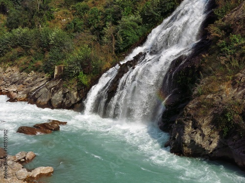 Turquoise Marsyangdi river and waterfall. Scene near Jagat, Annapurna Conservation Area, Nepal.