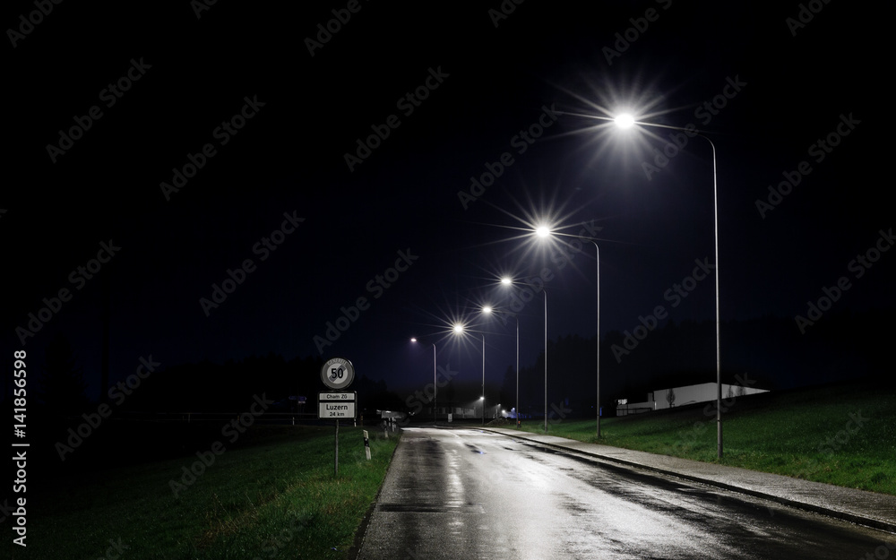 Street Lighting At Night On A Rainy Evening