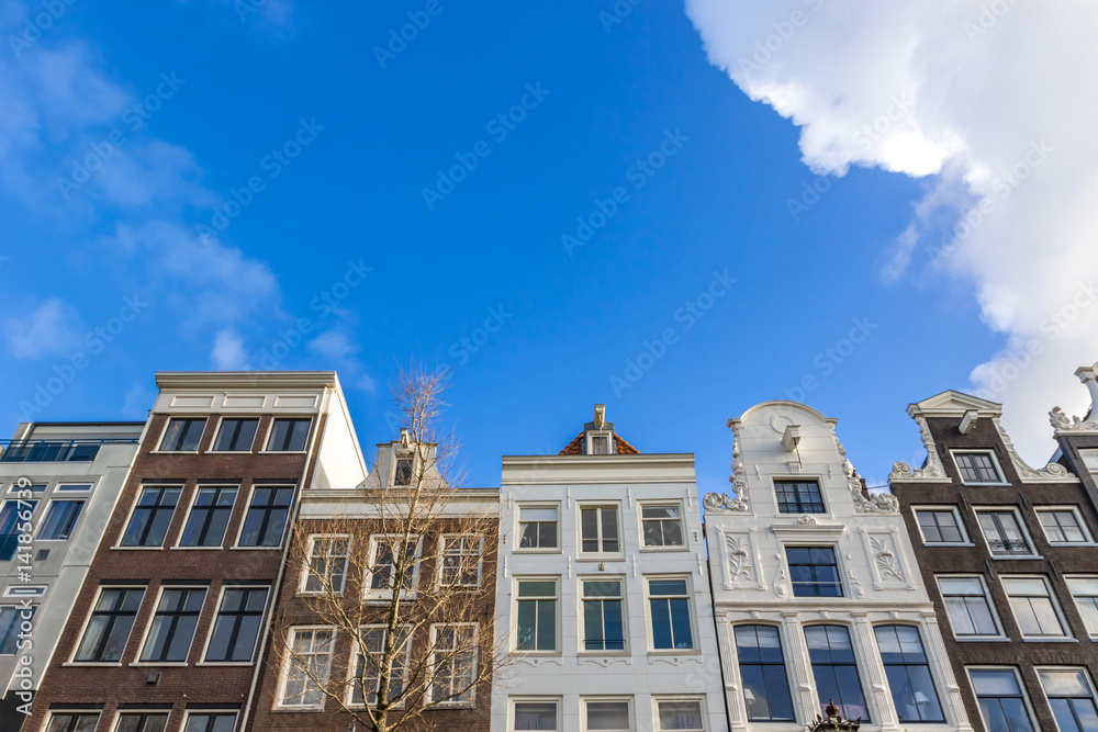 Old buildings in Amsterdam in sunny day Old buildings in Amsterdam in sunny day