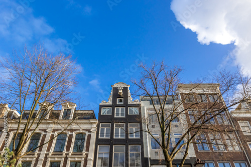 Old buildings in Amsterdam in sunny day