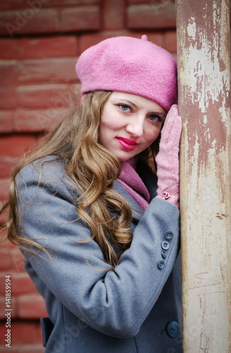 Portrait of a girl in a pink beret and a gray-blue coat / The picture was taken in Russia, in the city of Orenburg, in a courtyard on Kobozev street