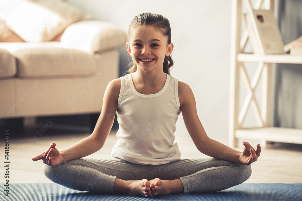 Little girl doing yoga Stock Photo