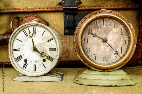 Two vintage weathered alarm clocks