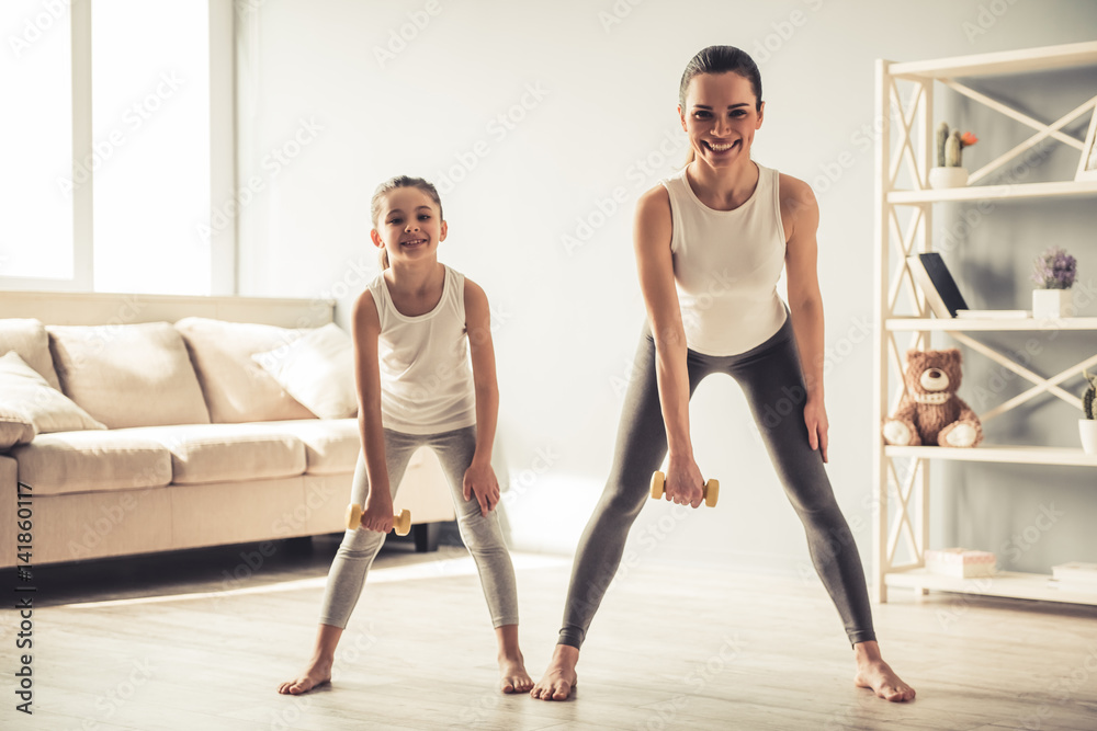 Mom and daughter working out Mom and daughter working out