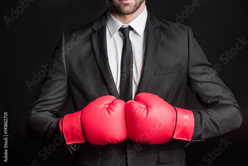 Businessman in boxing gloves © LIGHTFIELD STUDIOS