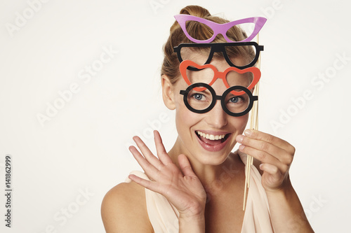 Tableau sur toile Beautiful woman with glasses disguise, smiling