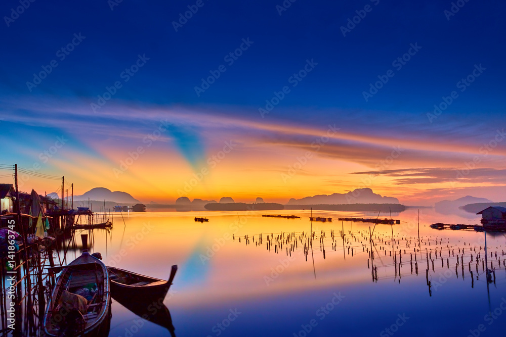 Sunrise at fishing village of Thailand, tropical beautiful landscape.