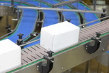 Automation - Cardboard boxes on conveyor belt in factory
