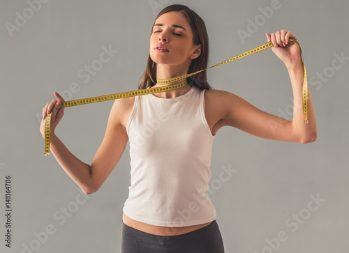 Obraz na plátne Girl and weight loss