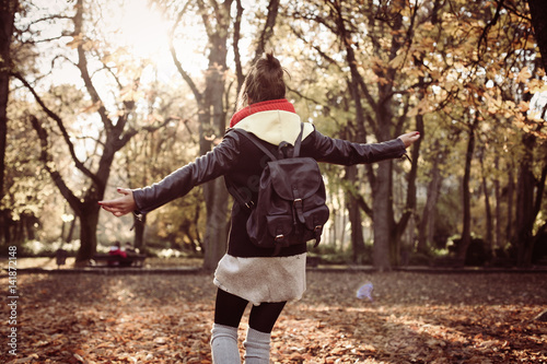 Young girl enjoys the park. © liderina