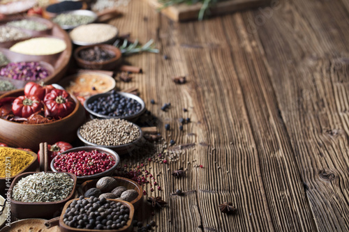 Fototapeta Naklejka Na Ścianę i Meble -  various dry spices on a wooden table