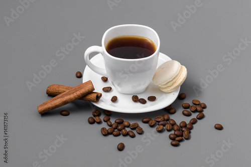 White cup of coffee on a gray background