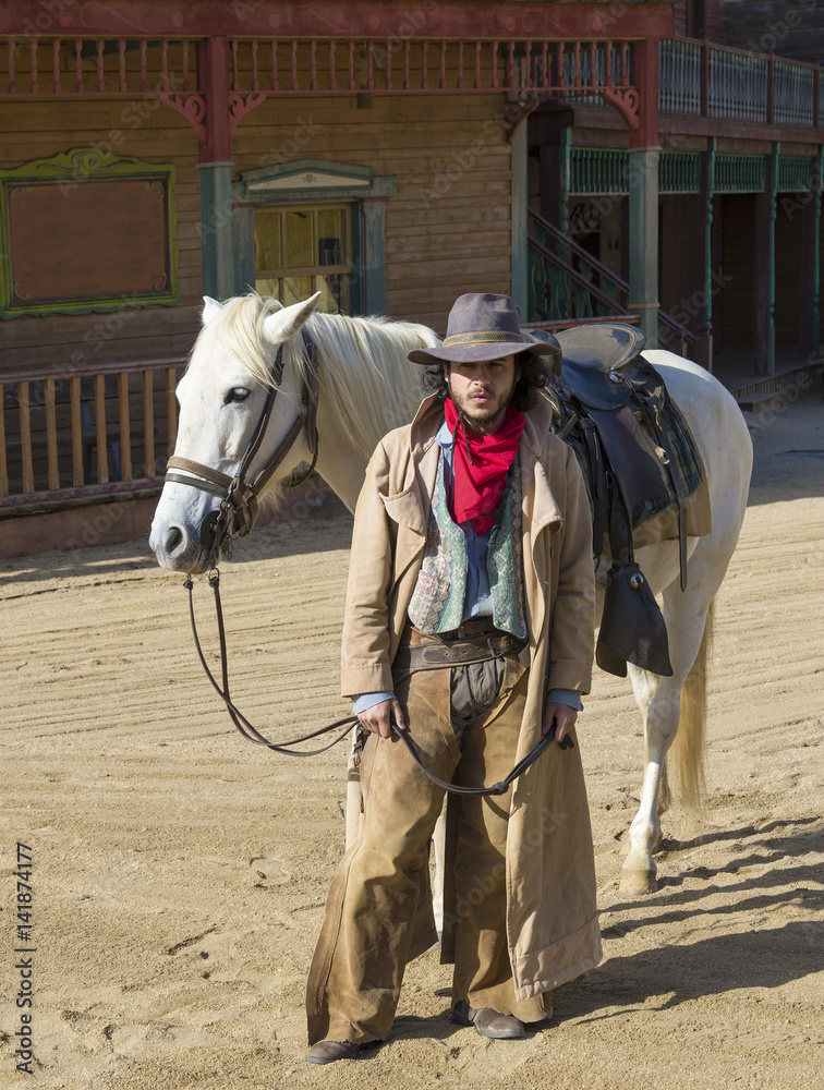 Φωτογραφία Cowboy with his horse at the Western Town at Mini Hollywood, Tabernas, Almeria P
