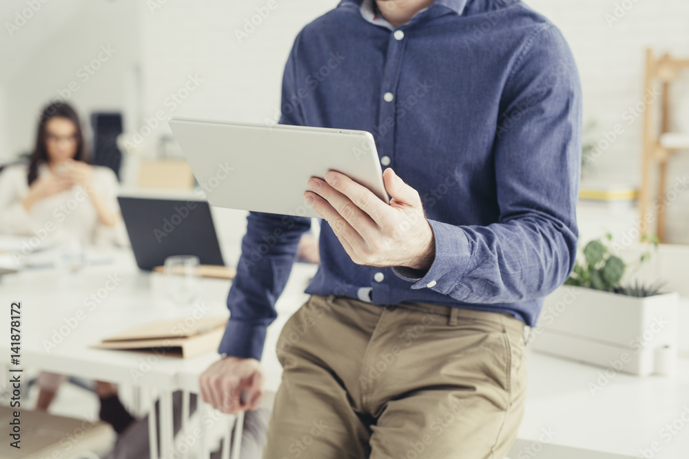 Unrecognizable Businessman Using Tablet