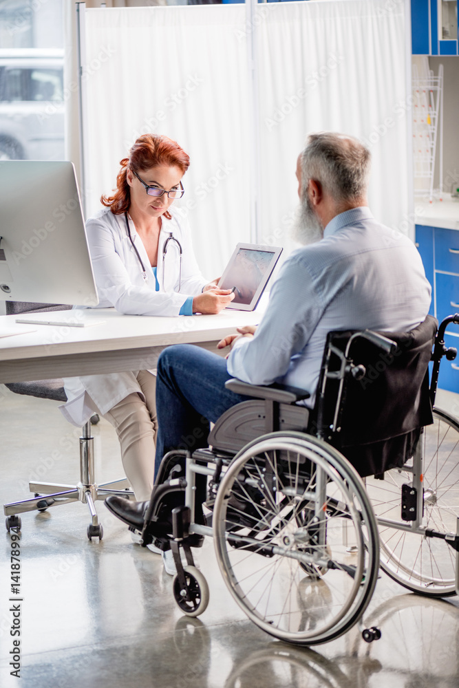 Doctor and patient in wheelchair