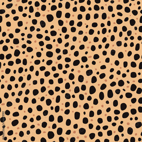 Seamless pattern. Imitation print of skin of cheetah. Black and brown spots on brown background.