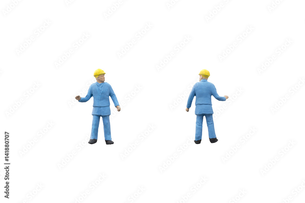 Miniature people worker construction concept on white background Miniature people worker construction concept on white background