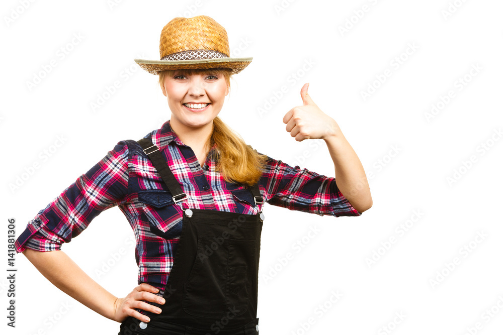 Woman in dungarees showing thumb up Woman in dungarees showing thumb up