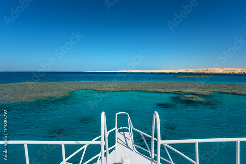 View at the coral sea from white yacht. Perfect place for snorkeling. Summer vacation © ianachyrva