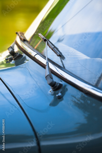 Ancient Car Closeup / Vintage car front detail windshield and wiper