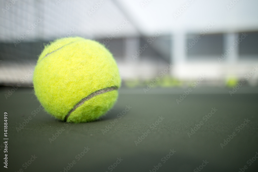 Tennis ball on tennis hard court