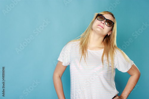 Blonde woman wearing sunglasses and summer clothing