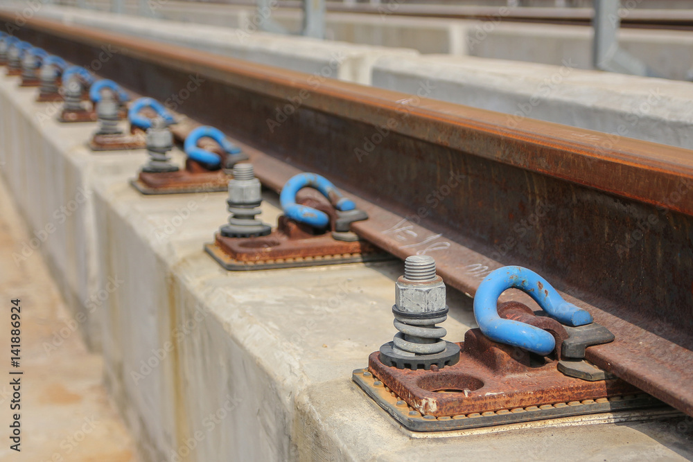 Close up Rail fastener for hold rail with concrete track plinth of sky train foto de Stock